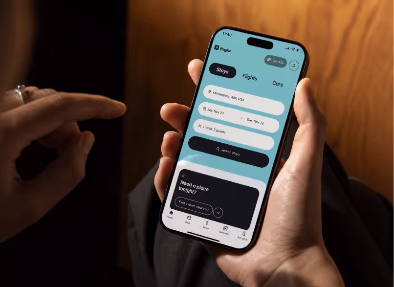 A person holding a cell phone with a screen displaying a list of flights.